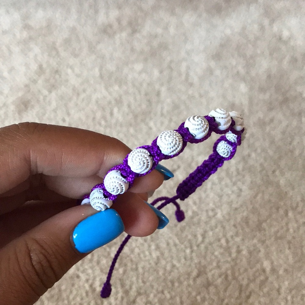 purple adjustable “shell” bracelet